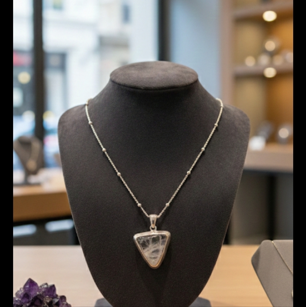 .925 18 " beaded chain with polozhed quartz pendant encased in sterling